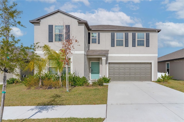 view of front facade featuring a front yard and a garage