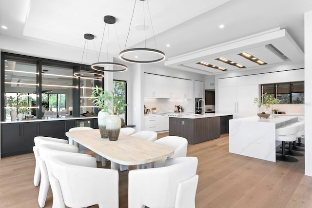 dining area featuring light wood-type flooring