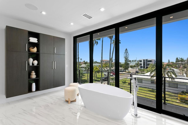 bedroom featuring a wall of windows