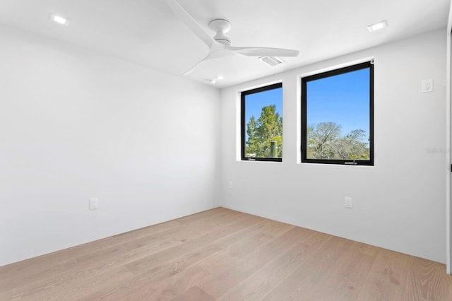 empty room featuring light hardwood / wood-style flooring and ceiling fan