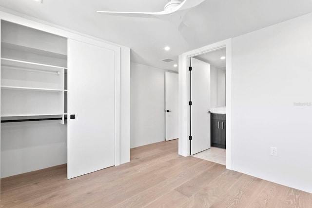 interior space featuring ceiling fan, a closet, and light hardwood / wood-style flooring