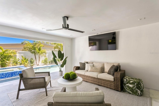 interior space with ceiling fan