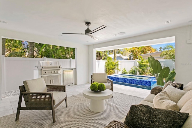 sunroom featuring ceiling fan