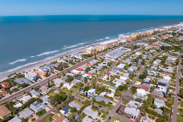 birds eye view of property featuring a view of the beach and a water view