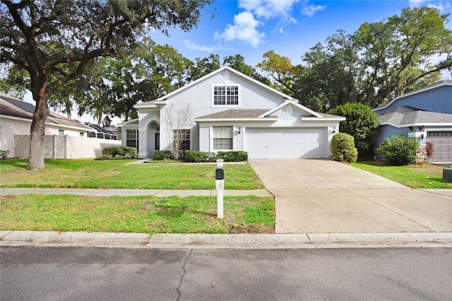 view of front of property with a front lawn and a garage