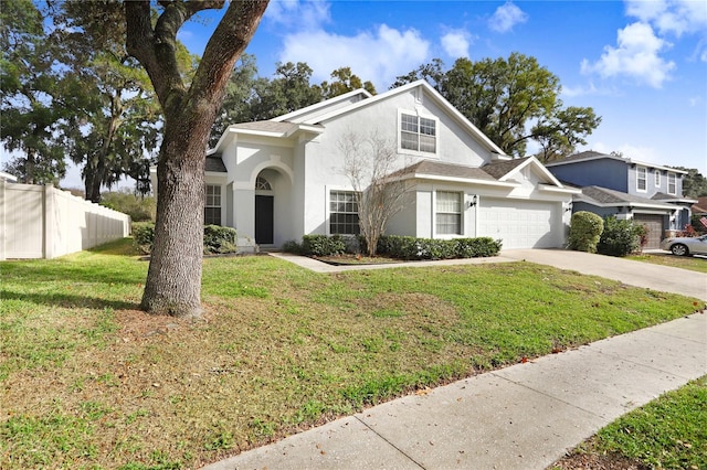 view of front facade with a front lawn and a garage