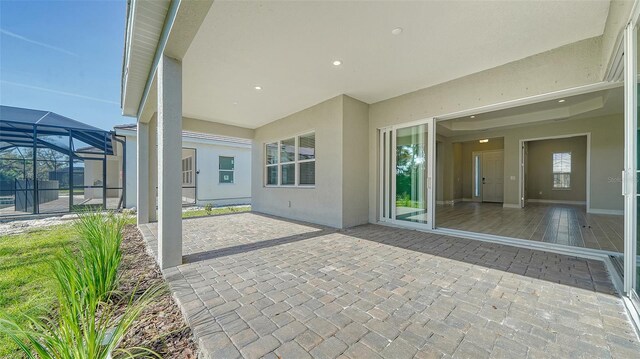 view of patio / terrace with glass enclosure