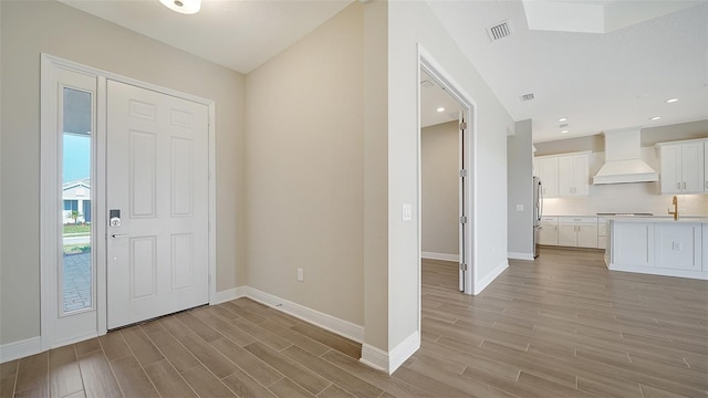 entryway featuring light hardwood / wood-style flooring and sink