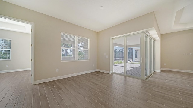 spare room featuring hardwood / wood-style floors