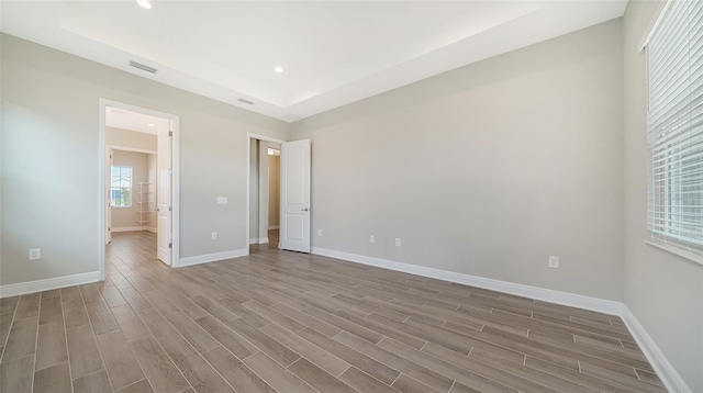 spare room with hardwood / wood-style flooring