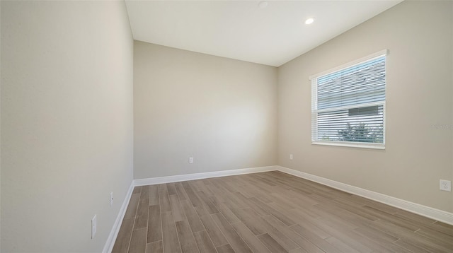 unfurnished room featuring light hardwood / wood-style floors