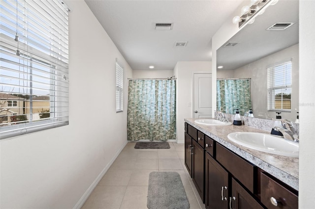 bathroom featuring vanity, a shower with curtain, and tile patterned flooring