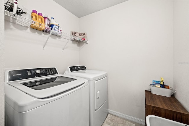 laundry area with separate washer and dryer