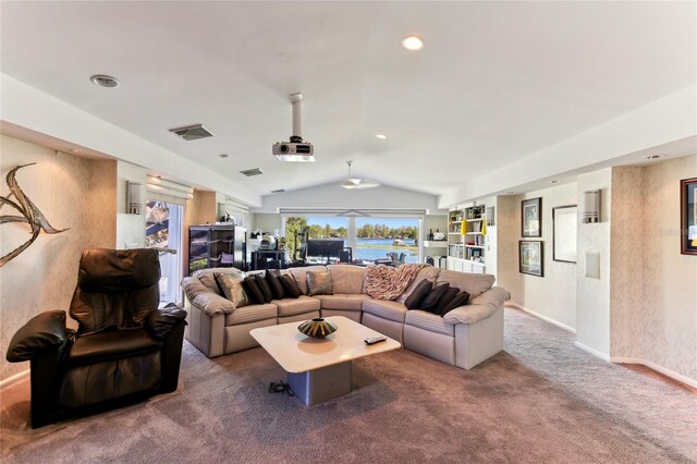 carpeted living room with lofted ceiling