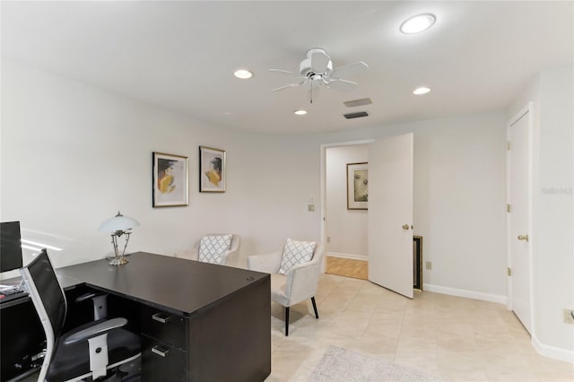 office space with light tile patterned floors and ceiling fan