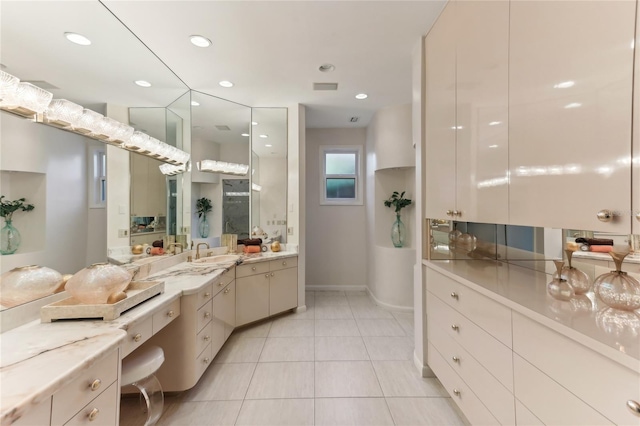 bathroom featuring vanity and tile patterned flooring