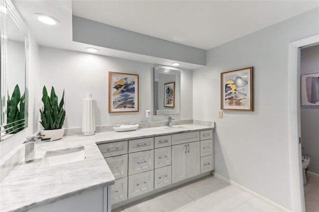 bathroom with vanity and tile patterned flooring