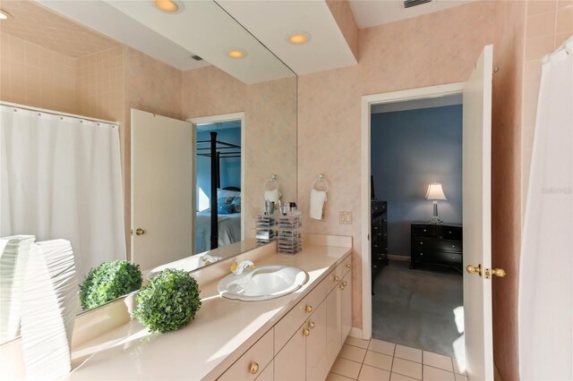 bathroom with tile patterned flooring and vanity