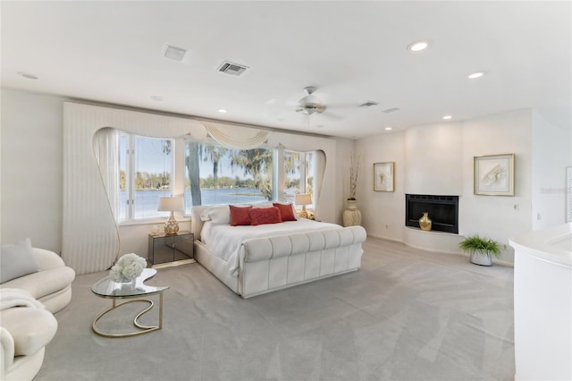 bedroom with light colored carpet and ceiling fan