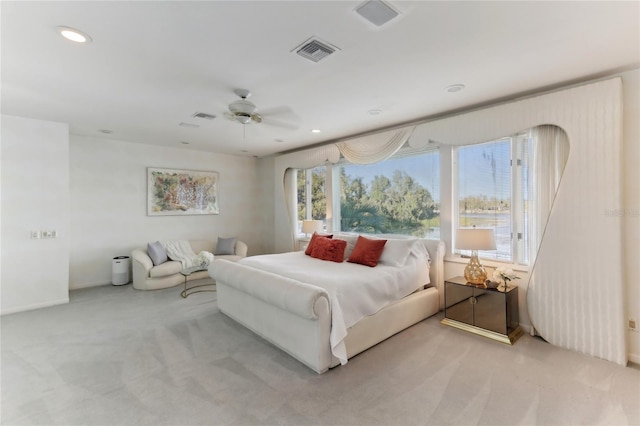 bedroom featuring light carpet and ceiling fan