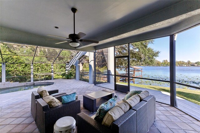 view of patio with a water view, ceiling fan, and an outdoor hangout area