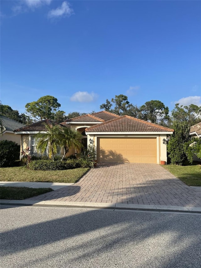 view of front of home with a garage