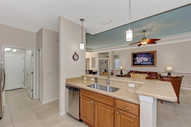 kitchen with stainless steel appliances, decorative light fixtures, light tile flooring, ceiling fan with notable chandelier, and sink