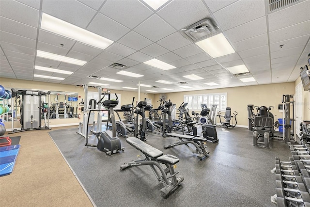 workout area featuring a paneled ceiling