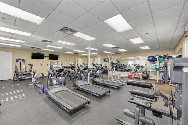 workout area featuring a drop ceiling