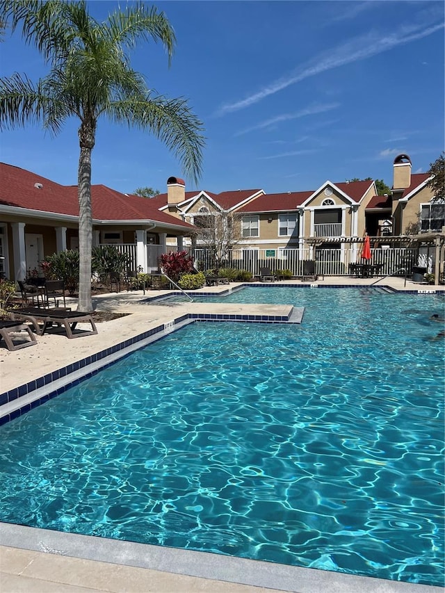 view of swimming pool with a patio