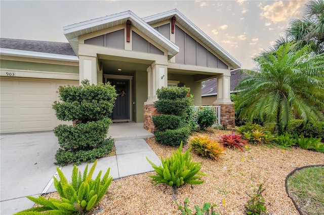 view of exterior entry with a garage