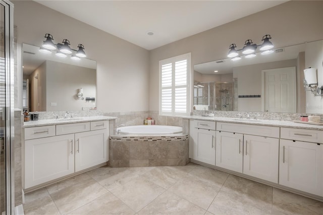 bathroom with vanity, separate shower and tub, and tile patterned floors