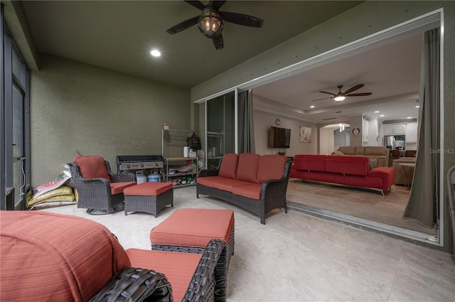 view of patio featuring an outdoor hangout area and ceiling fan