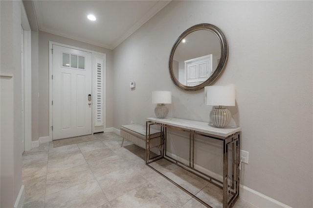 foyer featuring crown molding