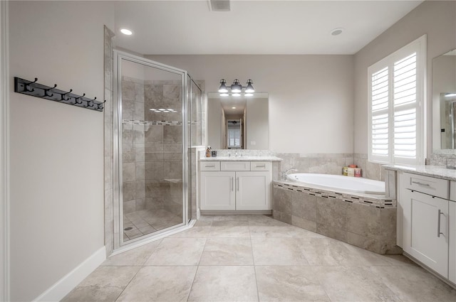 bathroom with vanity, shower with separate bathtub, and tile patterned floors