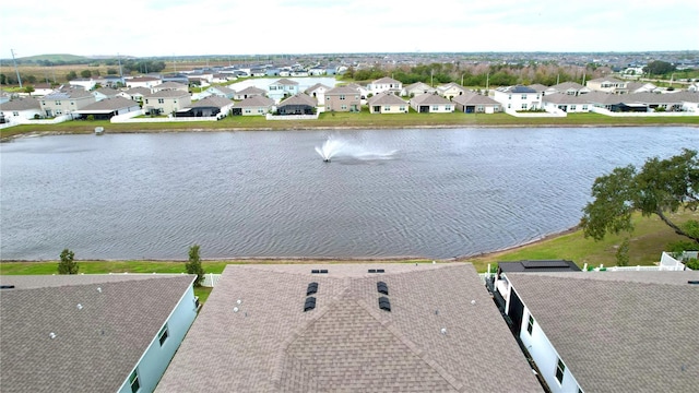 aerial view featuring a residential view and a water view