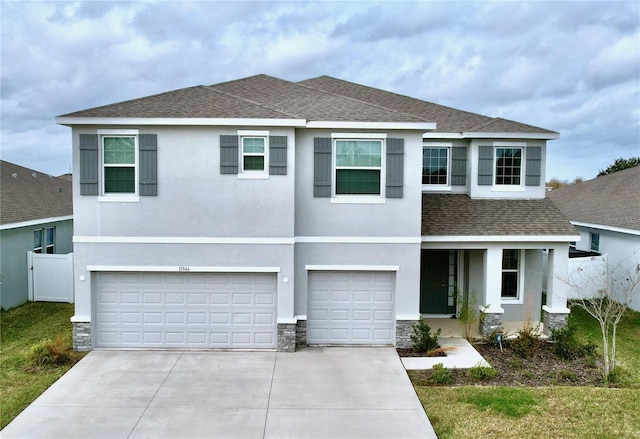 view of front facade with a garage, a shingled roof, stone siding, driveway, and stucco siding