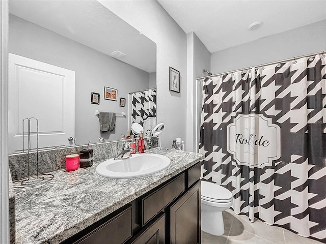 bathroom with a shower with curtain, visible vents, toilet, vanity, and tile patterned flooring