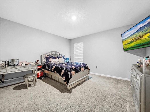 bedroom with carpet flooring and baseboards