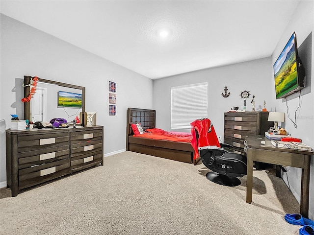 carpeted bedroom with baseboards