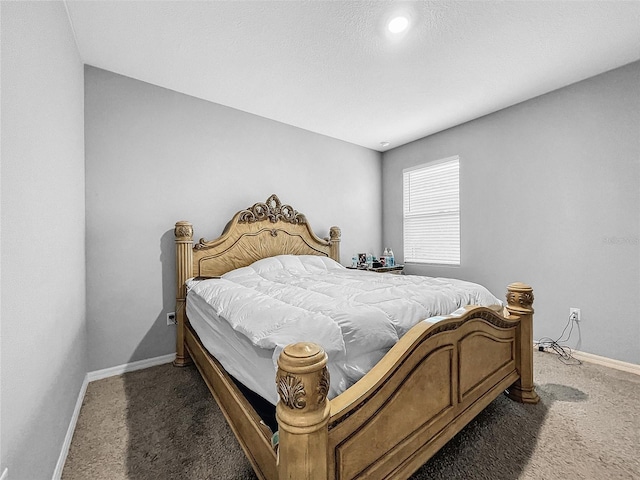 carpeted bedroom with baseboards