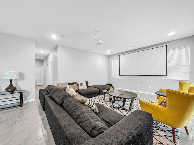 tiled home theater room featuring recessed lighting and baseboards