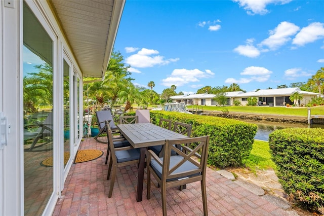 view of patio / terrace featuring a water view