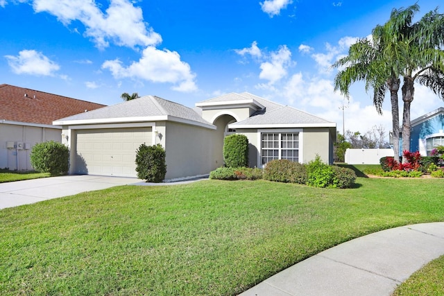 view of front of home with stucco siding, driveway, an attached garage, and a front yard