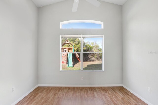 unfurnished room featuring lofted ceiling, light hardwood / wood-style flooring, and ceiling fan