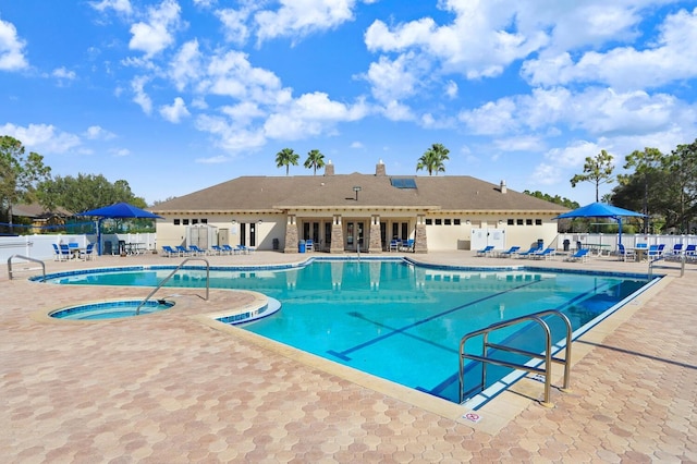 view of swimming pool with a patio area