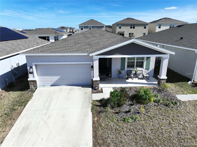 view of front of property featuring a garage and covered porch