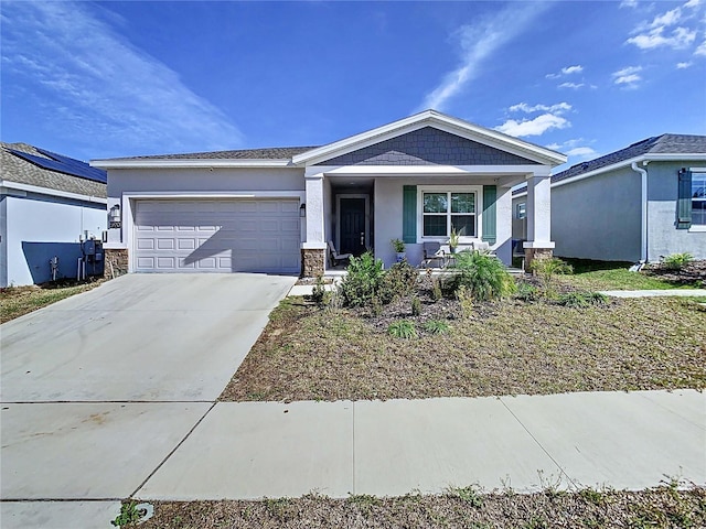 view of front of home featuring a garage and covered porch