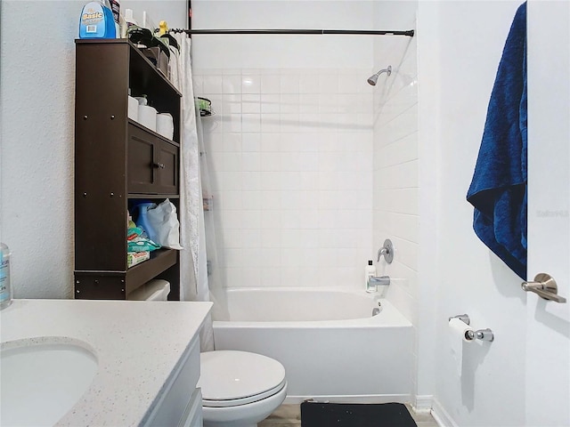 full bathroom featuring shower / tub combo, vanity, and toilet