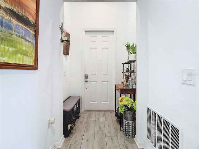 doorway with light wood-type flooring